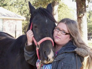 Meghan with Cass Oles Beau, a grandson of the horse that starred in the movie The Black Stallion. Horses have helped the Rio Vista, Texas, teen deal with her autism.  Photo courtesy of Meghan Dixon